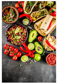 a variety of mexican food on a dark background